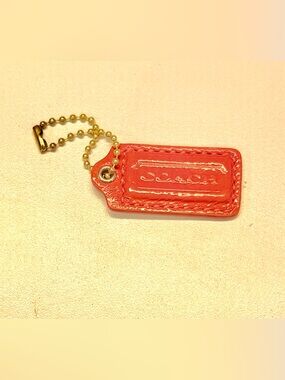Coach Orange Leather Bag Charm with Gold Ball Chain